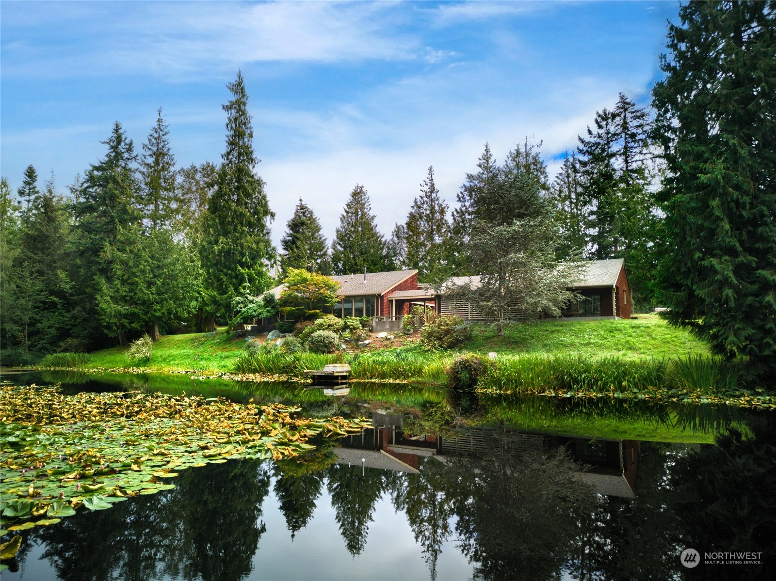 3686 Green Cliffs Road Anacortes, WA 98221 - Photo 1 of 1 a view of a garden with large trees