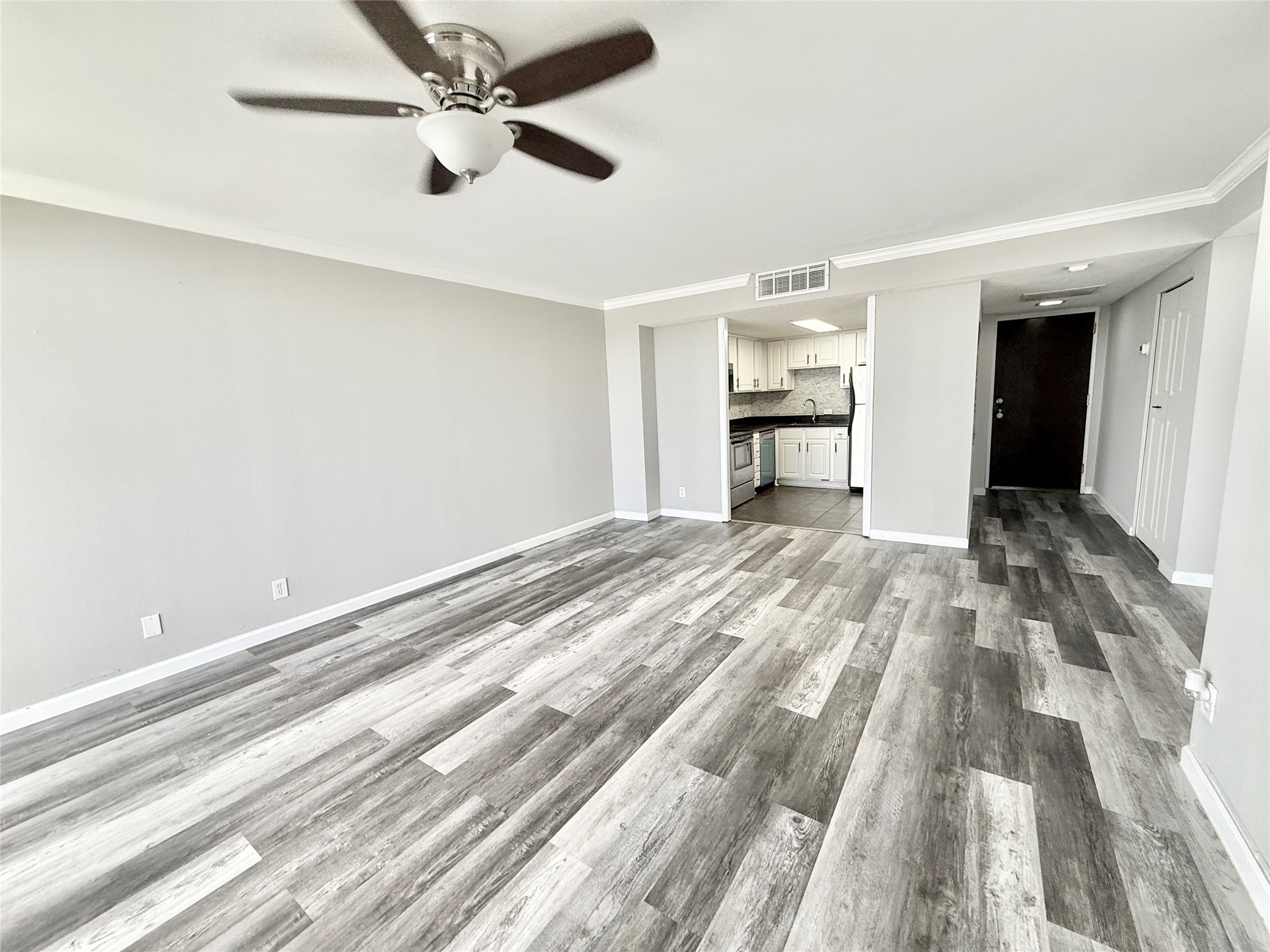 2016 Main Street, Unit 2204 Houston, TX 77002 - Photo 13 of 24 Living room with view tow kitchen from balcony doors