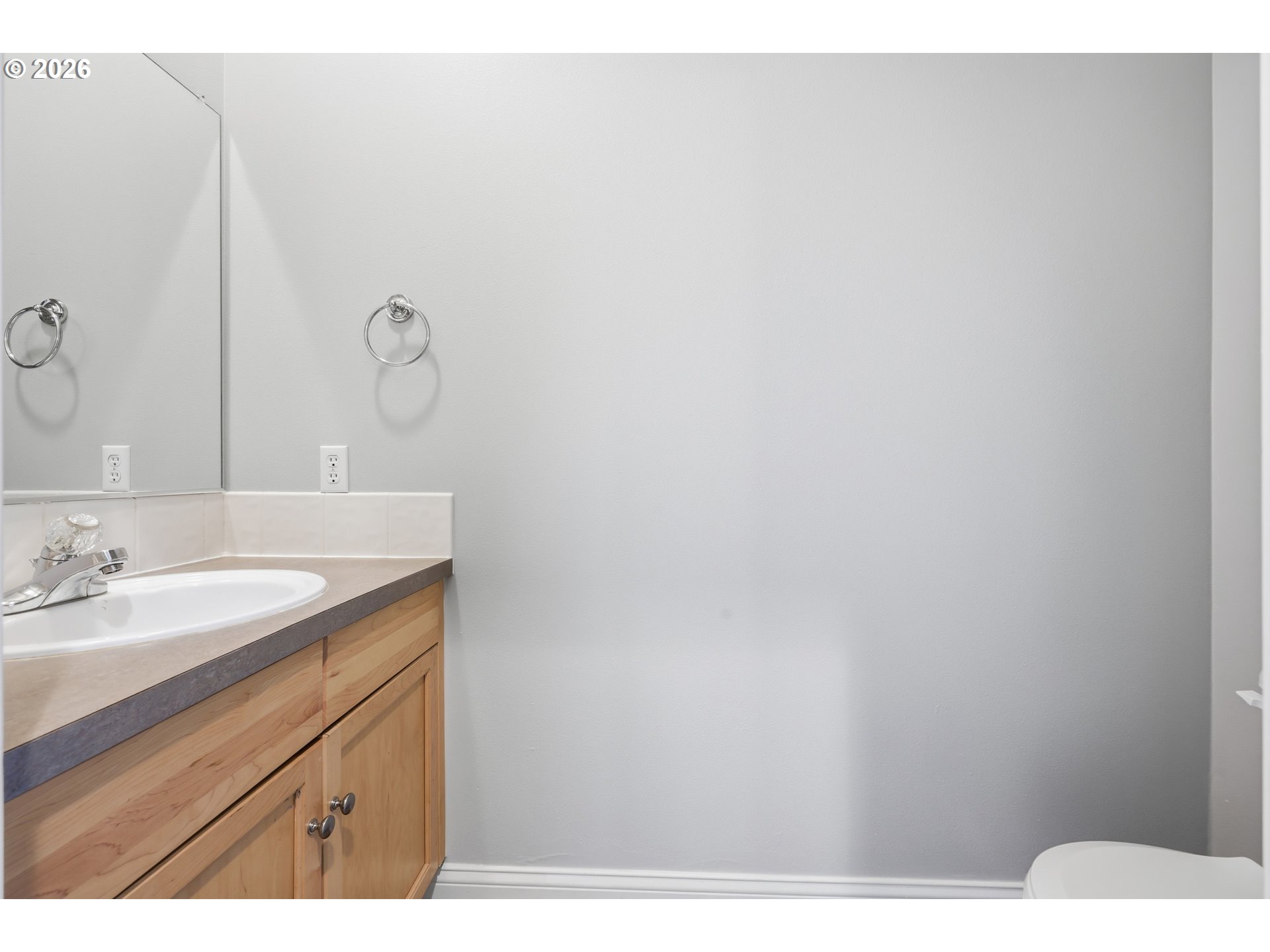 20070 Southwest Cedar Grove Lane Beaverton, OR 97003 - Photo 14 of 19 a bathroom with a sink and a mirror