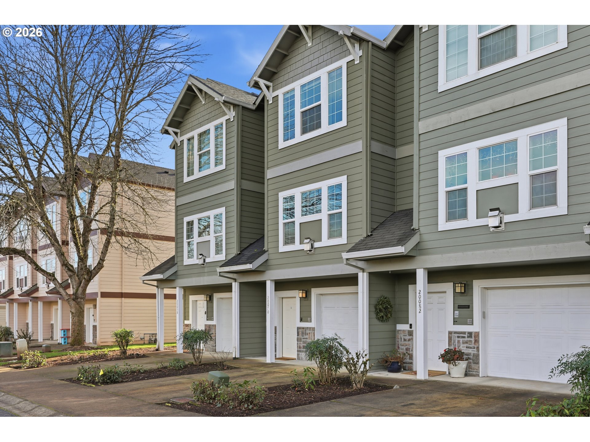 20070 Southwest Cedar Grove Lane Beaverton, OR 97003 - Photo 3 of 19 a front view of residential houses with yard