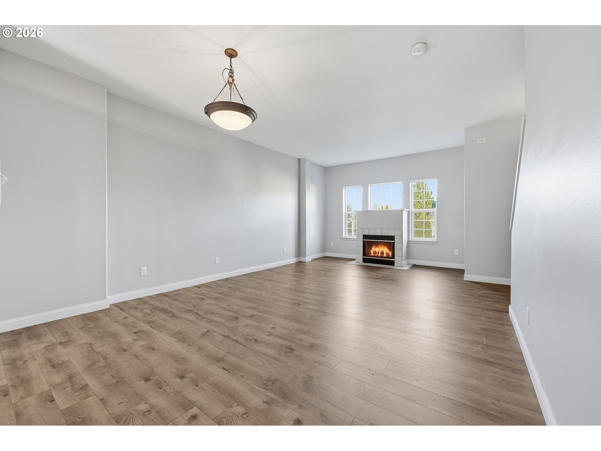 20070 Southwest Cedar Grove Lane Beaverton, OR 97003 - Photo 4 of 19 a view of empty room with wooden floor