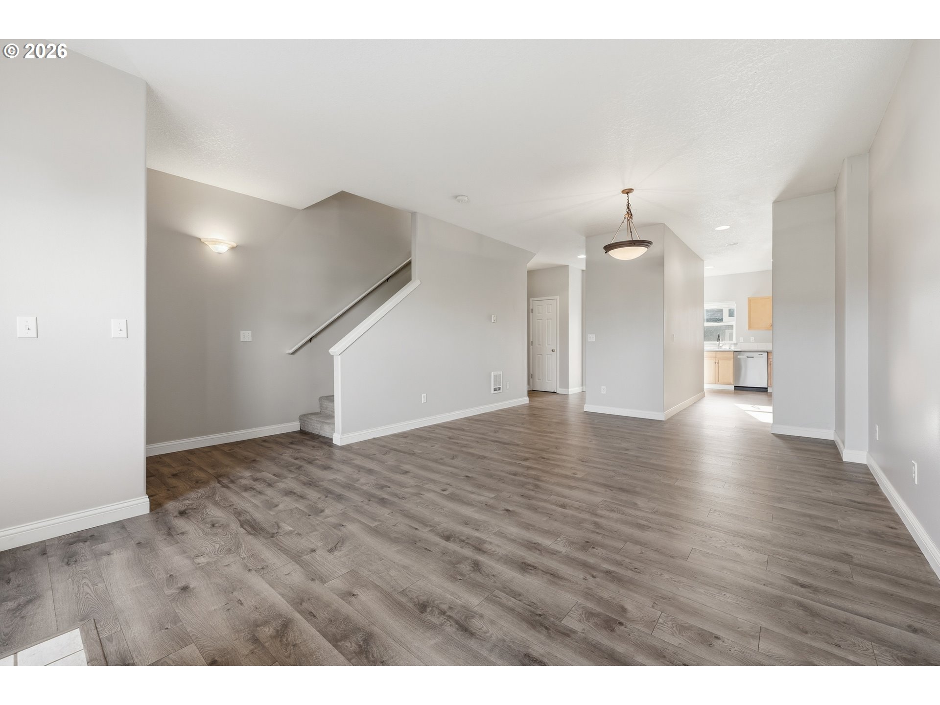 20070 Southwest Cedar Grove Lane Beaverton, OR 97003 - Photo 5 of 19 a view of an empty room with wooden floor