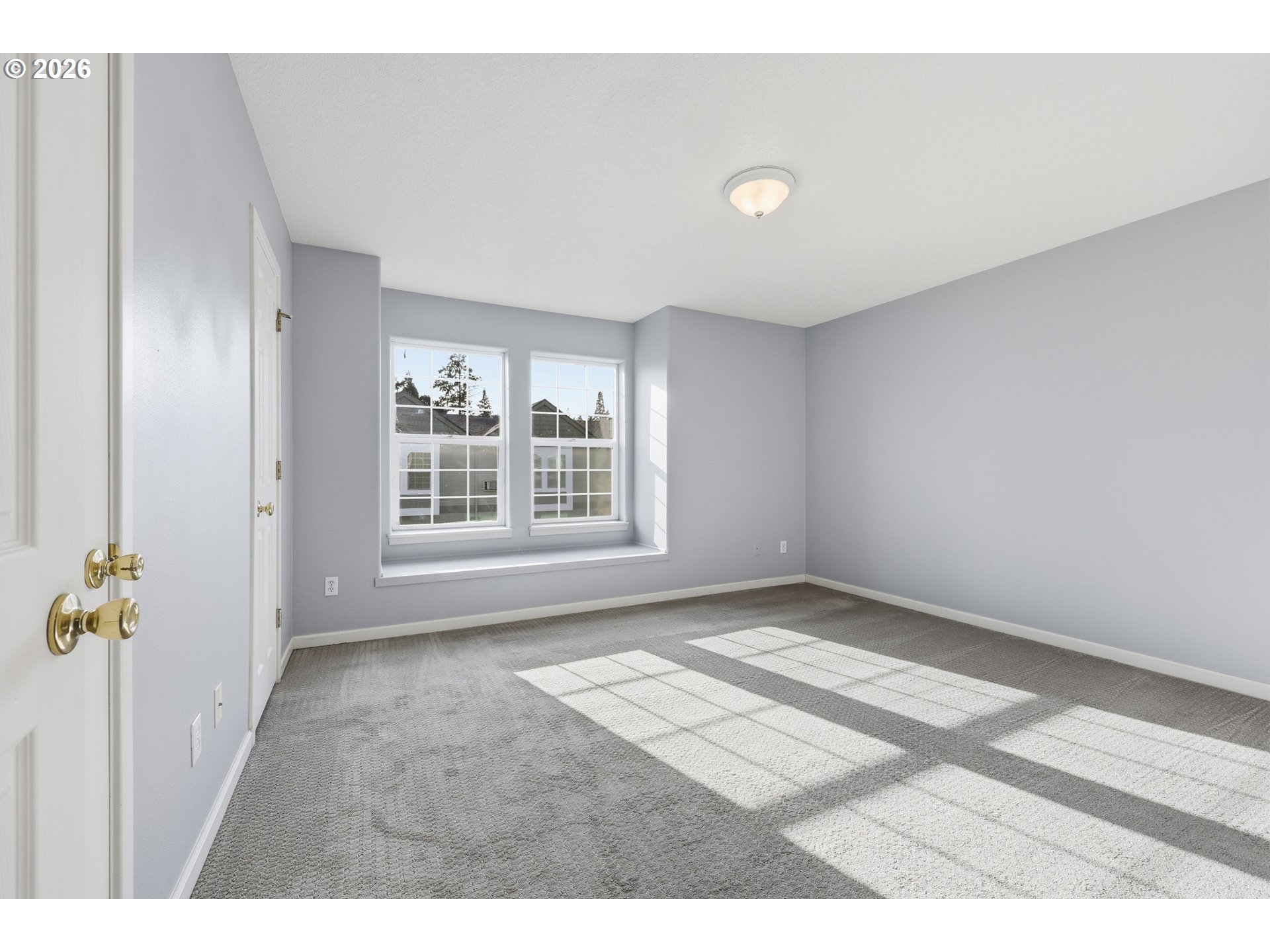 20070 Southwest Cedar Grove Lane Beaverton, OR 97003 - Photo 9 of 19 a view of an empty room with a window