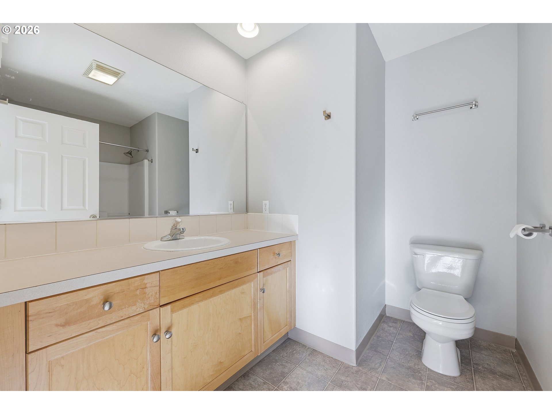 20070 Southwest Cedar Grove Lane Beaverton, OR 97003 - Photo 10 of 19 a bathroom with a toilet sink and mirror