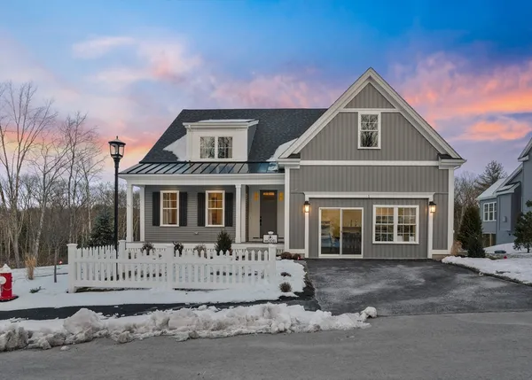 a front view of a house with a small yard