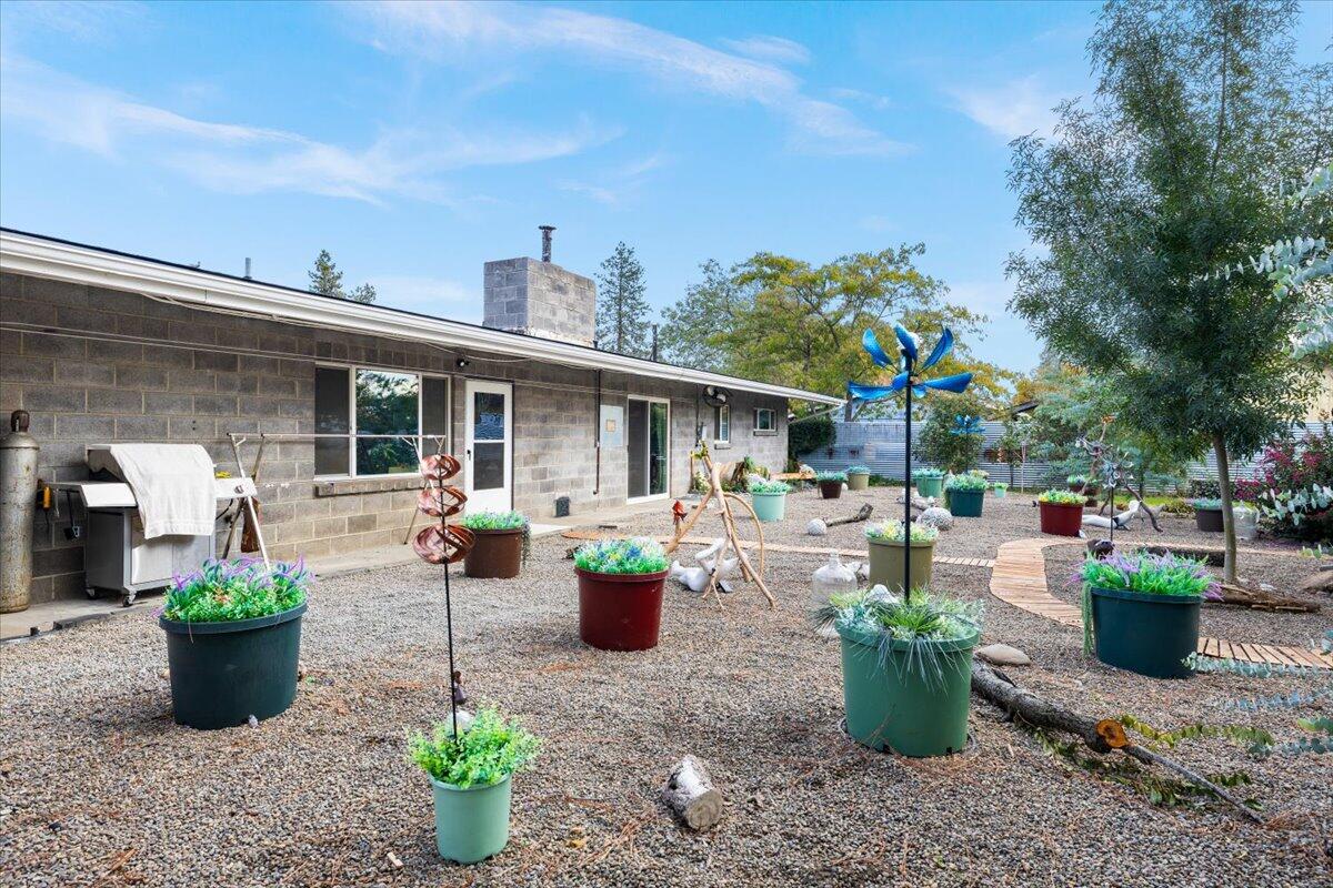 229 Gibbon Road Central Point, OR 97502 - Photo 22 of 25 a view of a house with sitting area and garden
