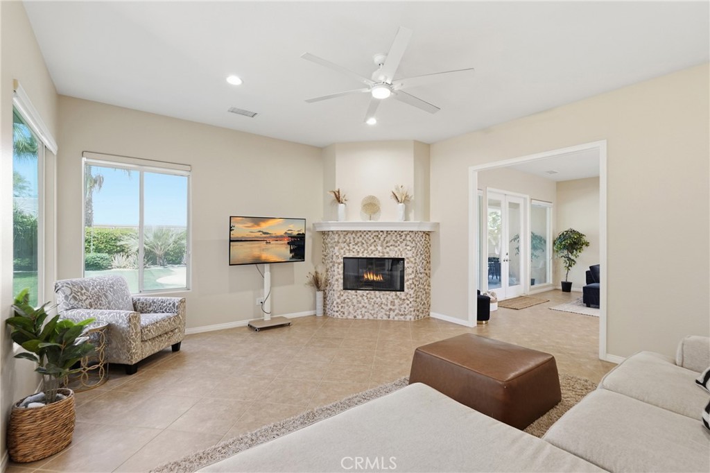 9 Orleans Road Rancho Mirage, CA 92270 - Photo 40 of 71 a living room with furniture and a fireplace