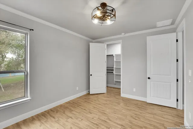 a bathroom with a granite countertop sink a toilet and a mirror