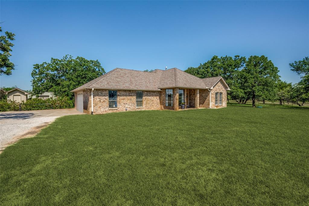 778 County Road 3141 Decatur, TX 76234 - Photo 3 of 25 a front view of a house with a garden