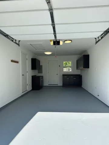 a kitchen with stove and cabinets
