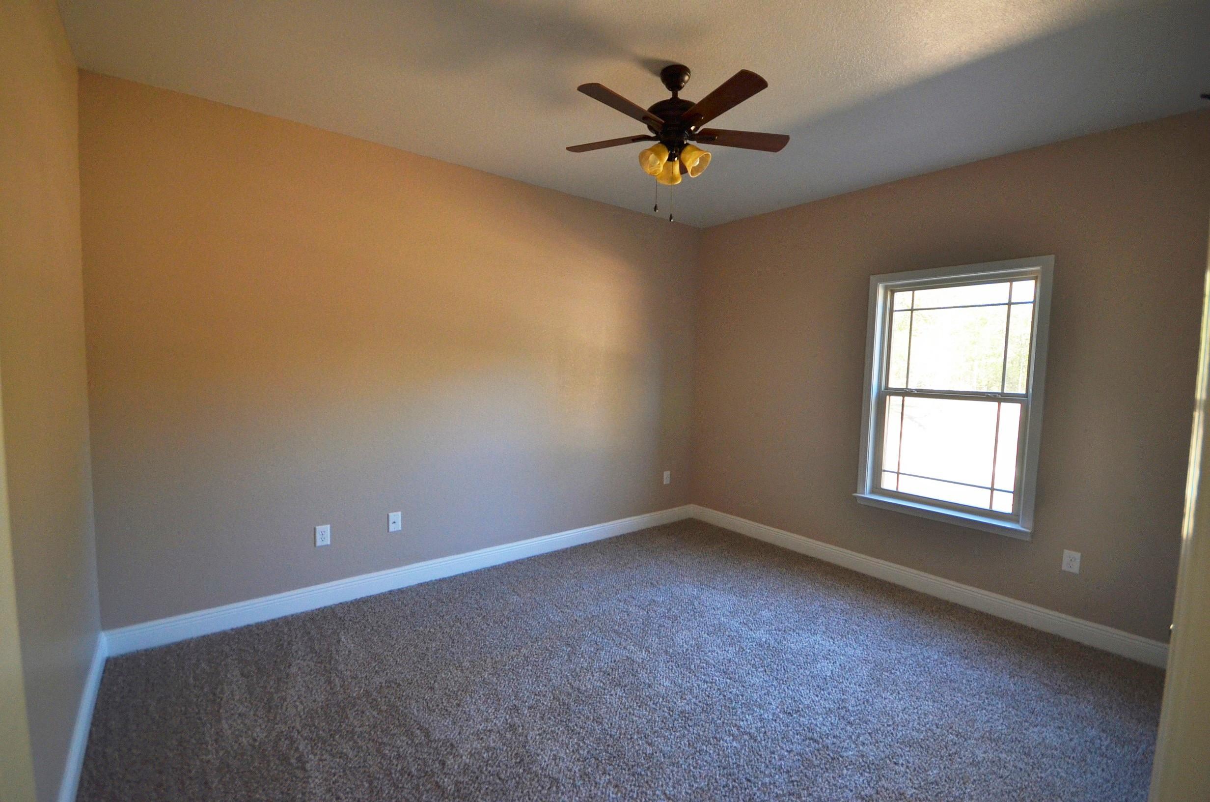 4009 Happy Trails Road Crestview, FL 32539 - Photo 22 of 30 an empty room with a window