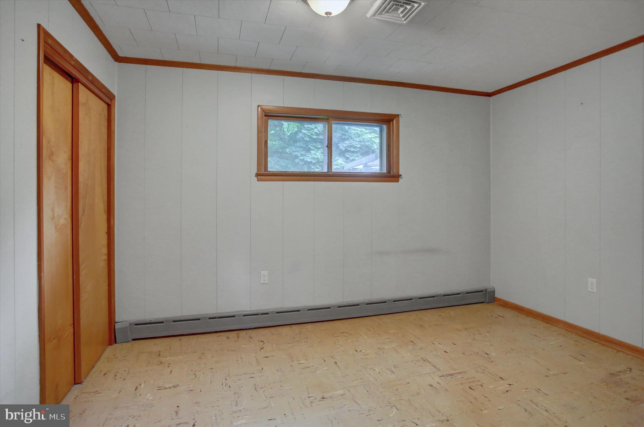 5156 Peach Orchard Road McConnellsburg, PA 17233 - Photo 16 of 34 an empty room with a door