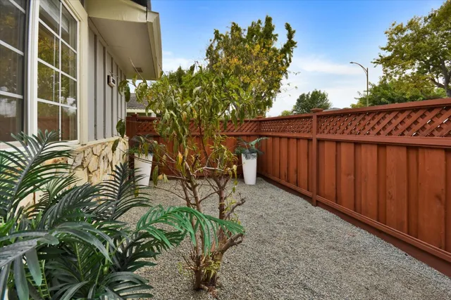 a view of balcony with wooden fence