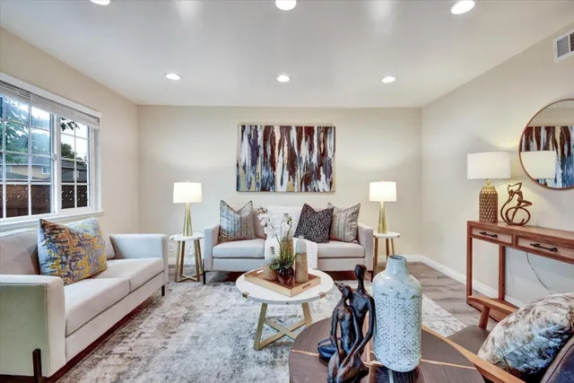 a living room with furniture and a window
