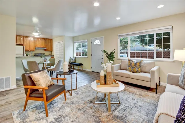 a living room with furniture and a table