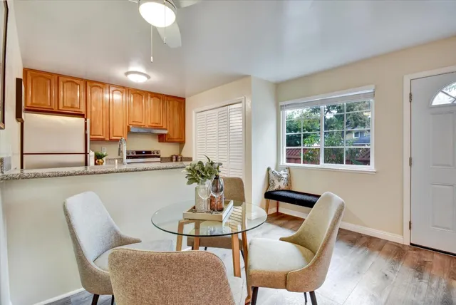 a view of a dining room with furniture window and outside view
