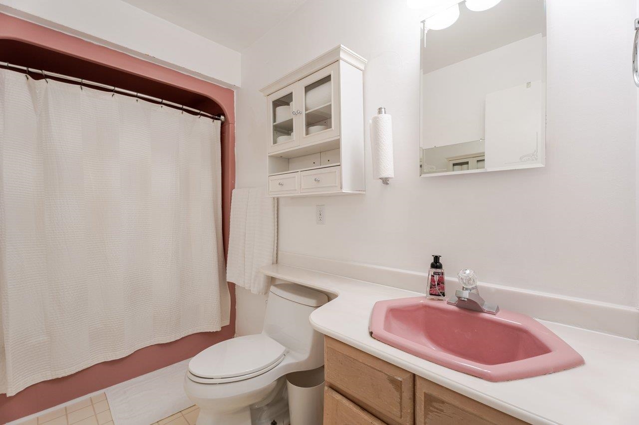 11918 Turleytown Road Broadway, VA 22815 - Photo 27 of 42 a bathroom with a sink toilet and mirror