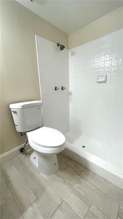 1439 Northwest 94th Way, Unit 1439 Coral Springs, FL 33071 - Photo 11 of 14 a white toilet sitting next to a bath tub shower