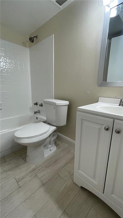 1439 Northwest 94th Way, Unit 1439 Coral Springs, FL 33071 - Photo 12 of 14 a bathroom with a sink a toilet and shower