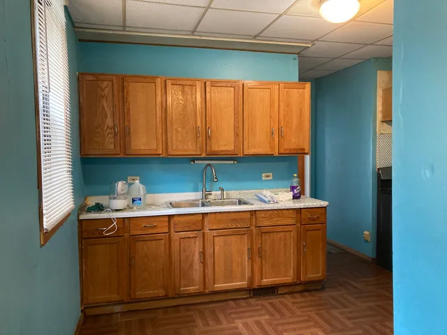 a kitchen with stainless steel appliances granite countertop a sink and a cabinets
