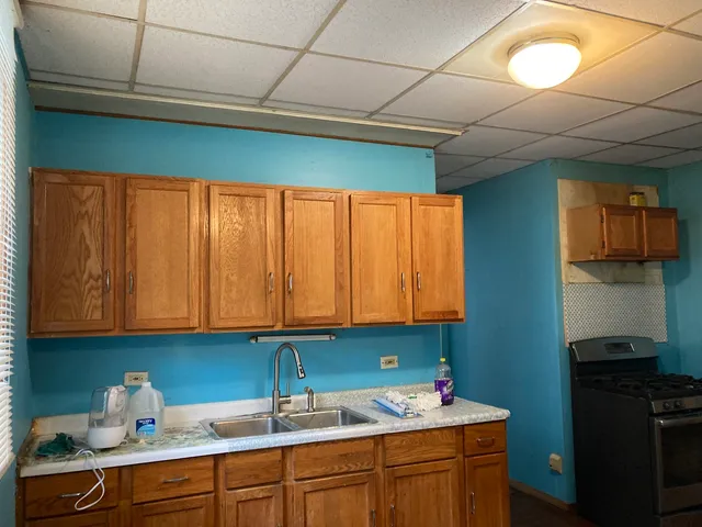 a view of storage and utility room with a refrigerator