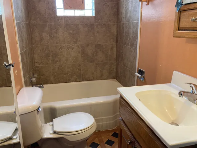 a bathroom with a bathtub and shower