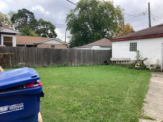 a view of a backyard with a small cabin