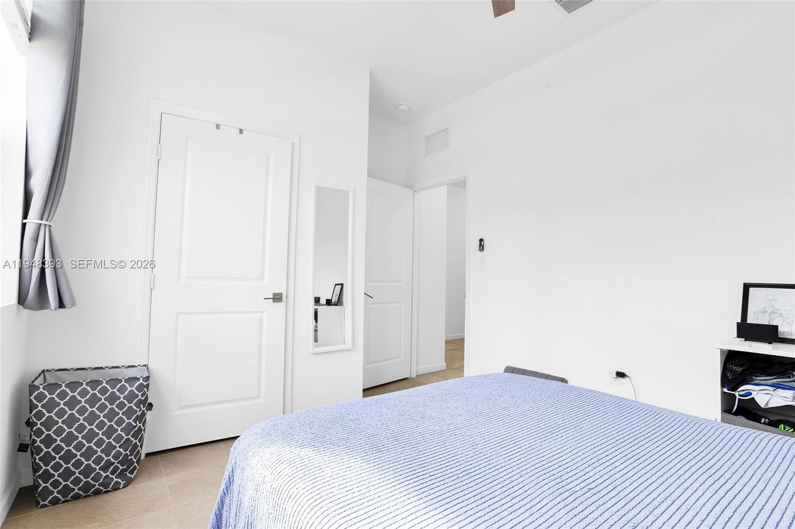 27440 Southwest 135th Ave Road Homestead, FL 33032 - Photo 11 of 75 a bedroom with a bed and a chair