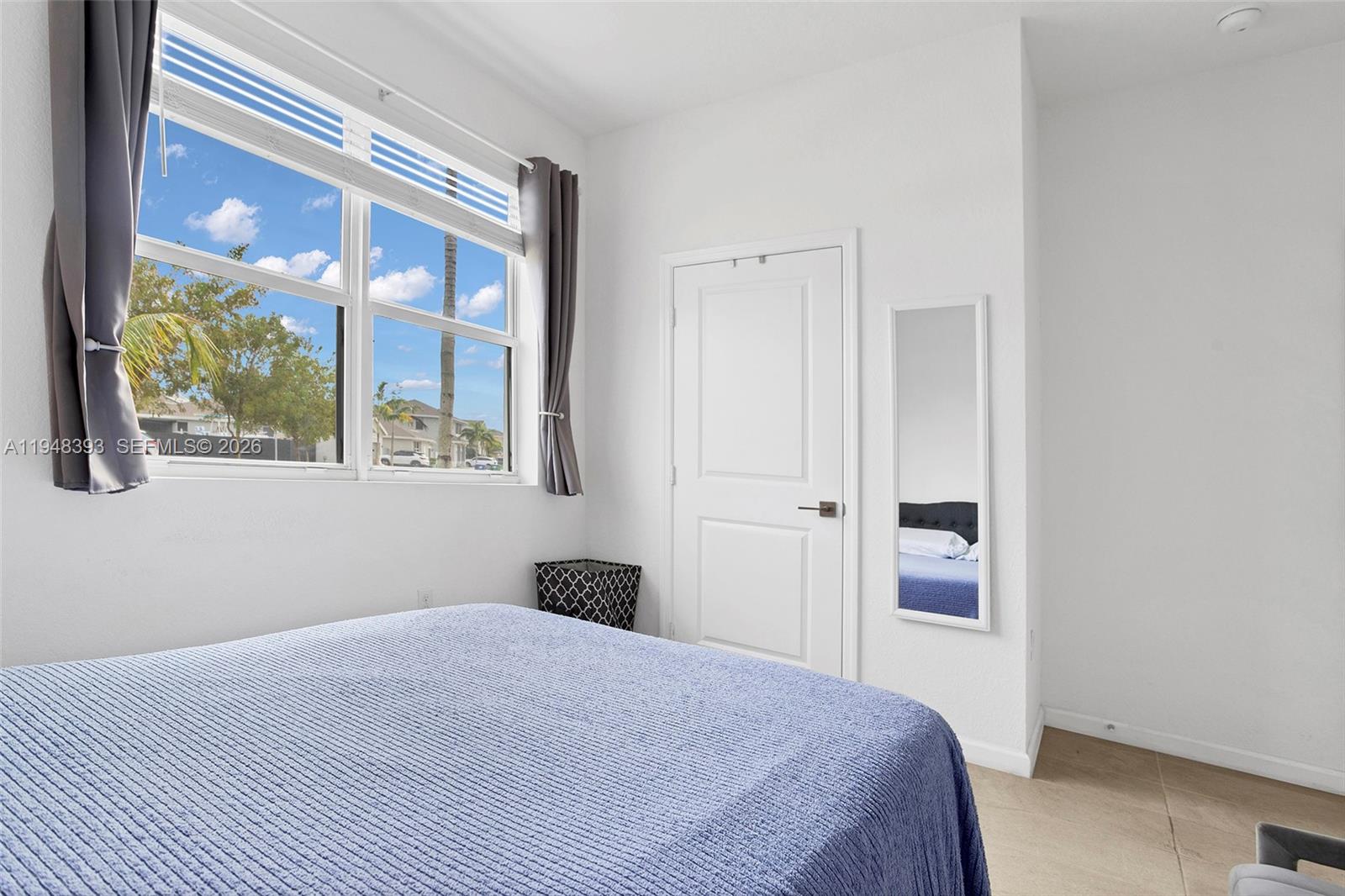 27440 Southwest 135th Ave Road Homestead, FL 33032 - Photo 12 of 75 a bedroom with a bed and a painting on the wall