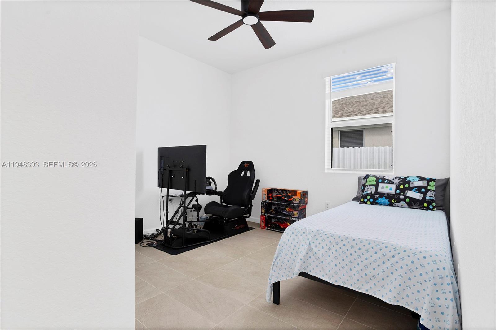 27440 Southwest 135th Ave Road Homestead, FL 33032 - Photo 13 of 75 a bedroom with bed and window