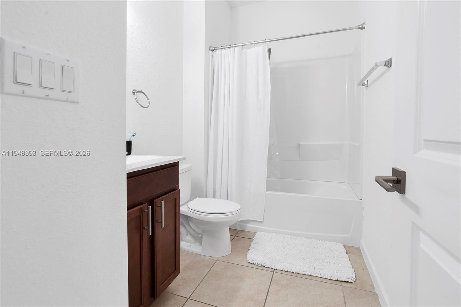 27440 Southwest 135th Ave Road Homestead, FL 33032 - Photo 16 of 75 a bathroom with a toilet a sink and shower