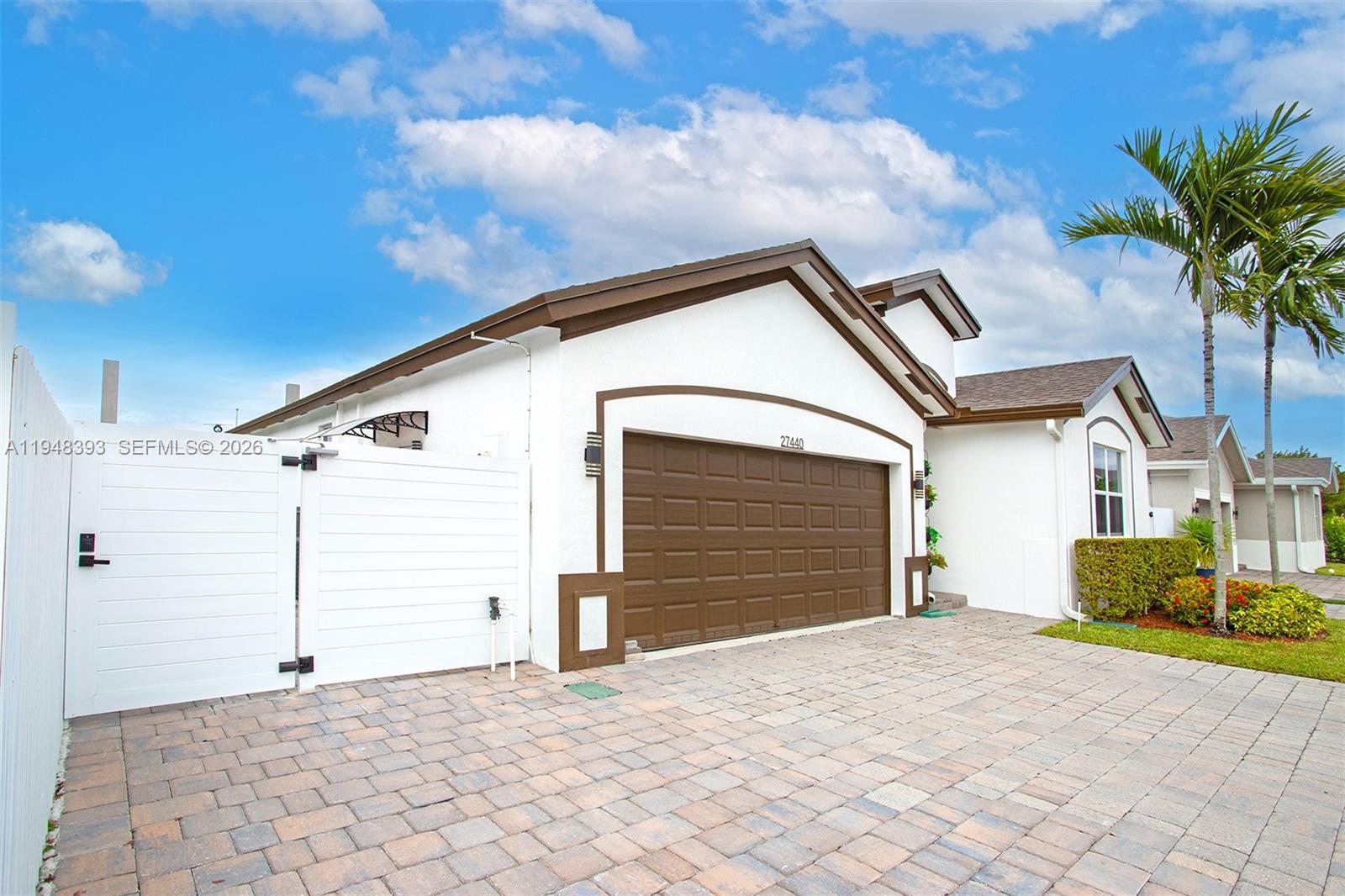 27440 Southwest 135th Ave Road Homestead, FL 33032 - Photo 24 of 75 a view of a house with a yard and garage