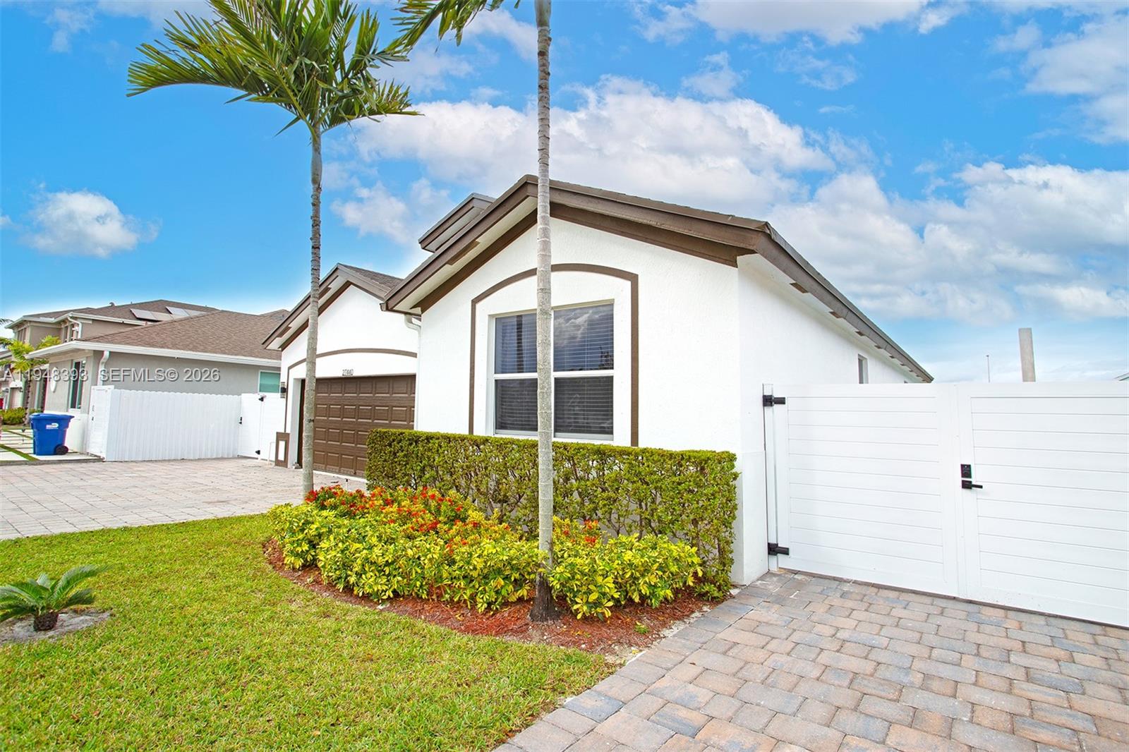 27440 Southwest 135th Ave Road Homestead, FL 33032 - Photo 26 of 75 a front view of a house with a garden