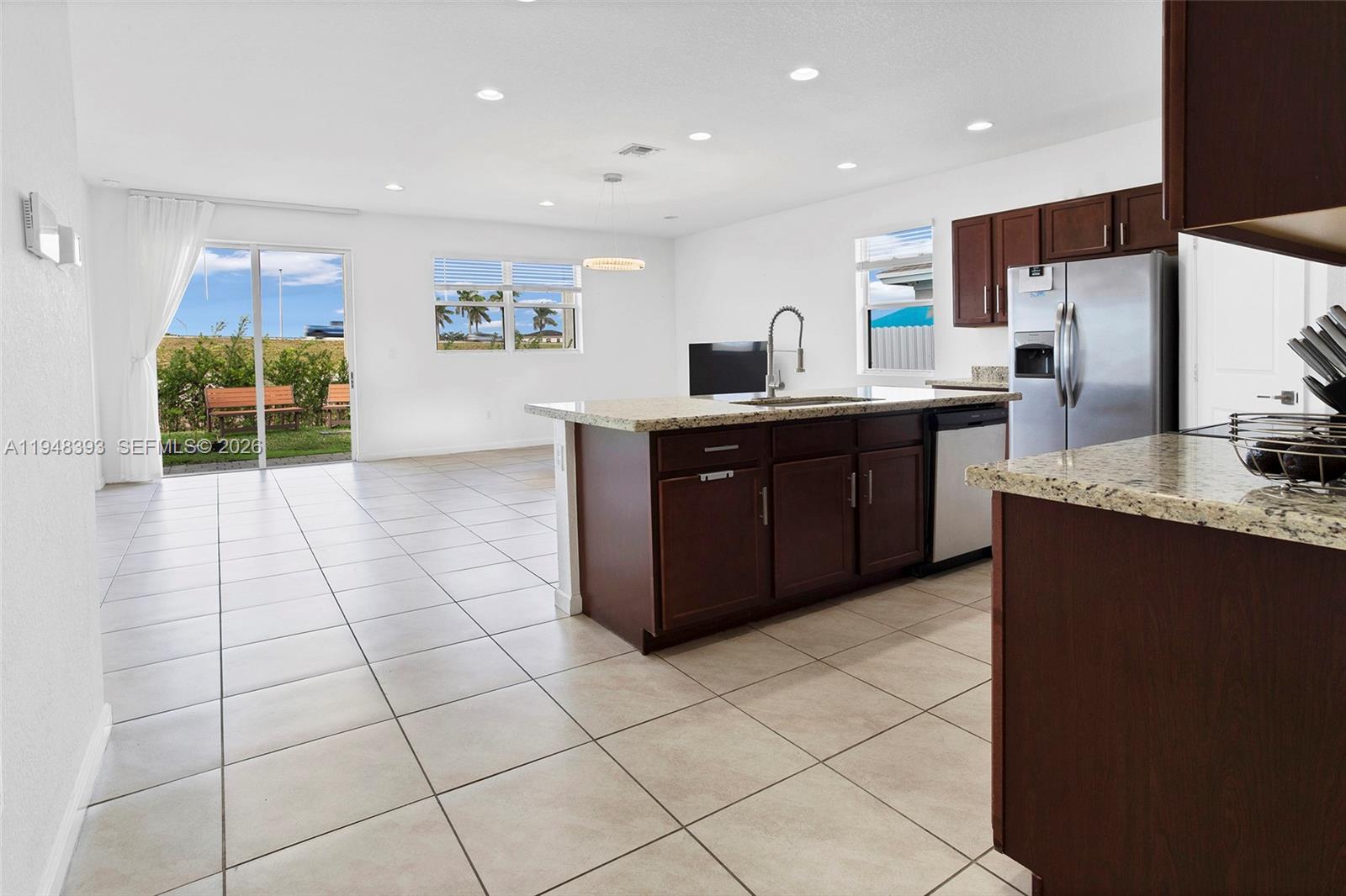 27440 Southwest 135th Ave Road Homestead, FL 33032 - Photo 3 of 75 a large kitchen with stainless steel appliances a sink and a counter top space