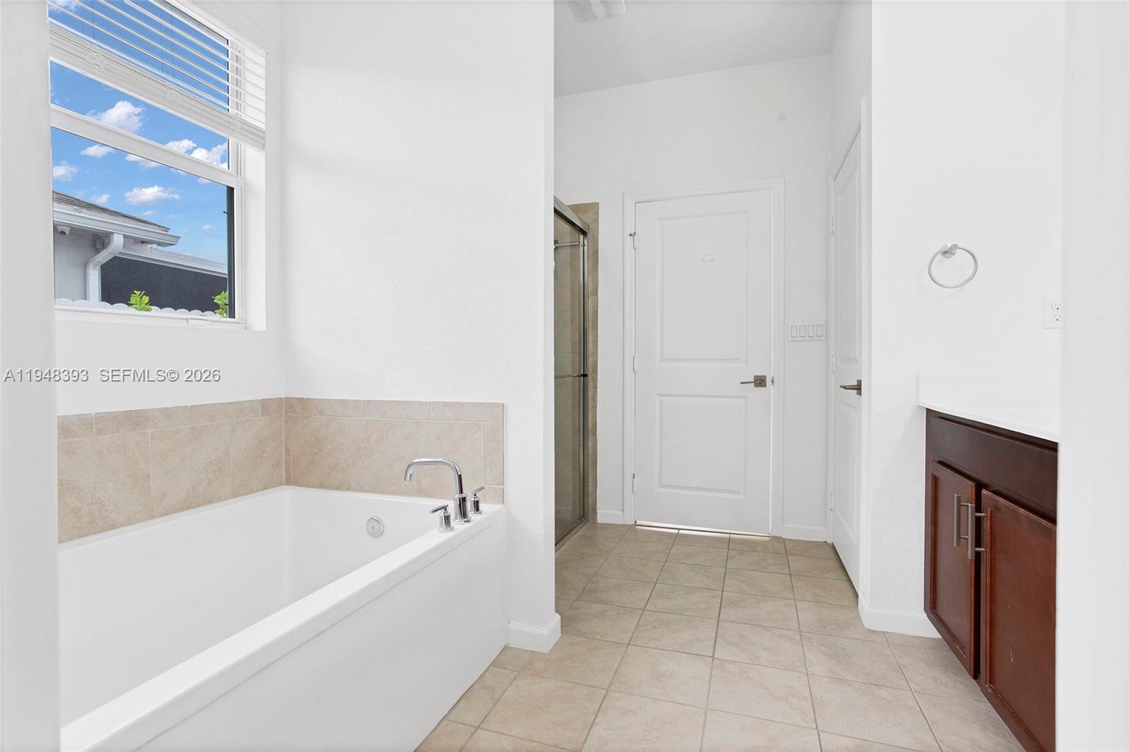 27440 Southwest 135th Ave Road Homestead, FL 33032 - Photo 52 of 75 a bathroom with a bathtub and a shower