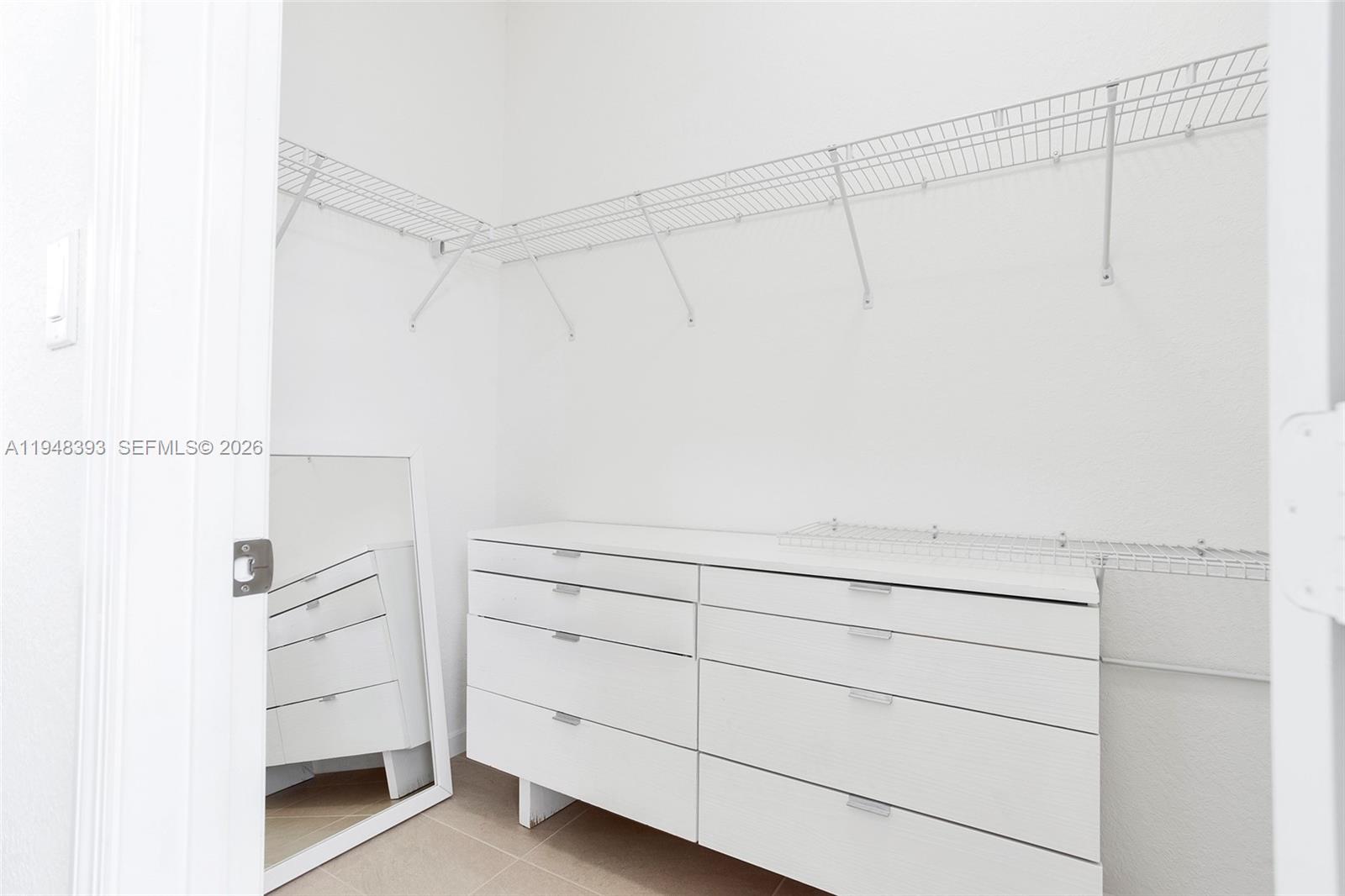 27440 Southwest 135th Ave Road Homestead, FL 33032 - Photo 53 of 75 a view of an empty walk in closet