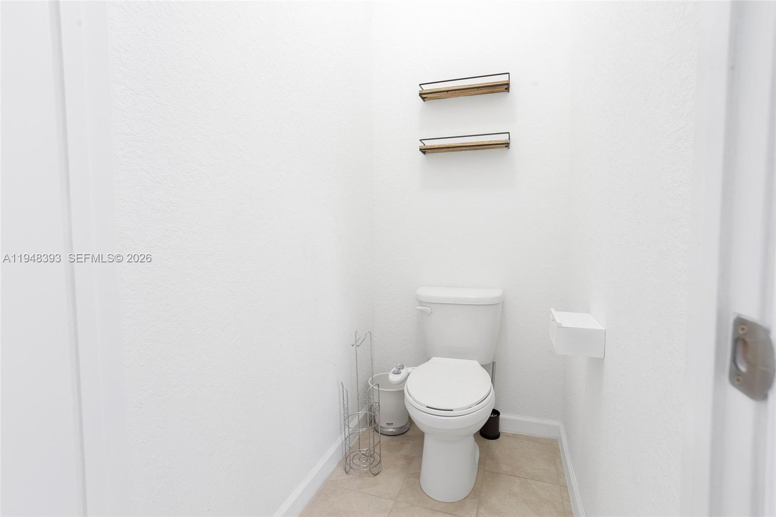 27440 Southwest 135th Ave Road Homestead, FL 33032 - Photo 54 of 75 a white toilet sitting next to a white wall
