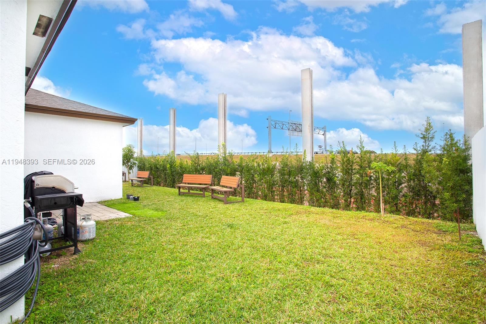 27440 Southwest 135th Ave Road Homestead, FL 33032 - Photo 55 of 75 a swimming pool with outdoor seating and yard