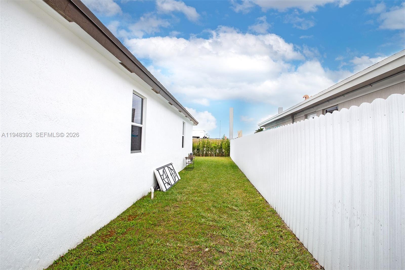 27440 Southwest 135th Ave Road Homestead, FL 33032 - Photo 57 of 75 a view of a backyard with plants