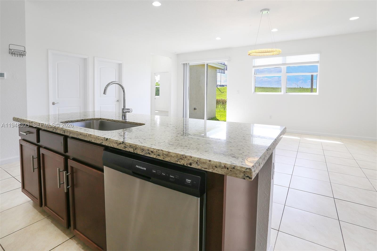 27440 Southwest 135th Ave Road Homestead, FL 33032 - Photo 59 of 75 a kitchen with granite countertop a sink and a granite counter tops