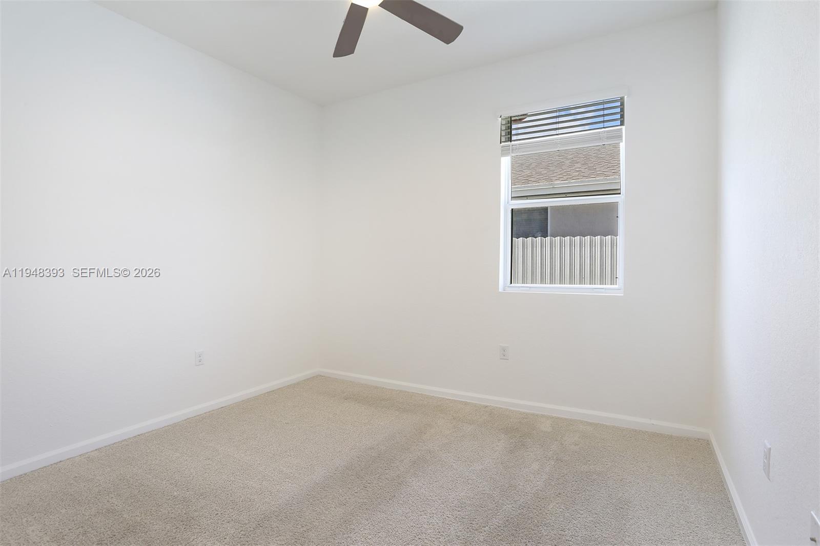 27440 Southwest 135th Ave Road Homestead, FL 33032 - Photo 61 of 75 an empty room with a window
