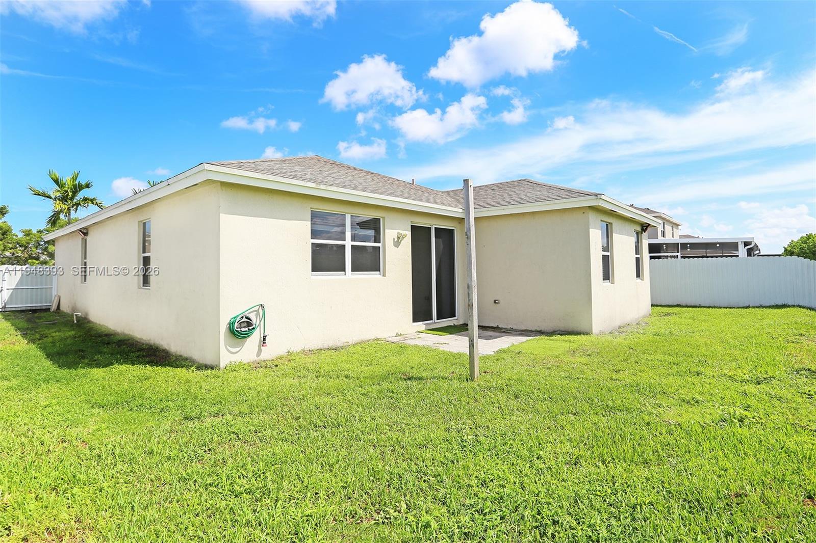 27440 Southwest 135th Ave Road Homestead, FL 33032 - Photo 65 of 75 a view of a backyard with potted plants and large tree