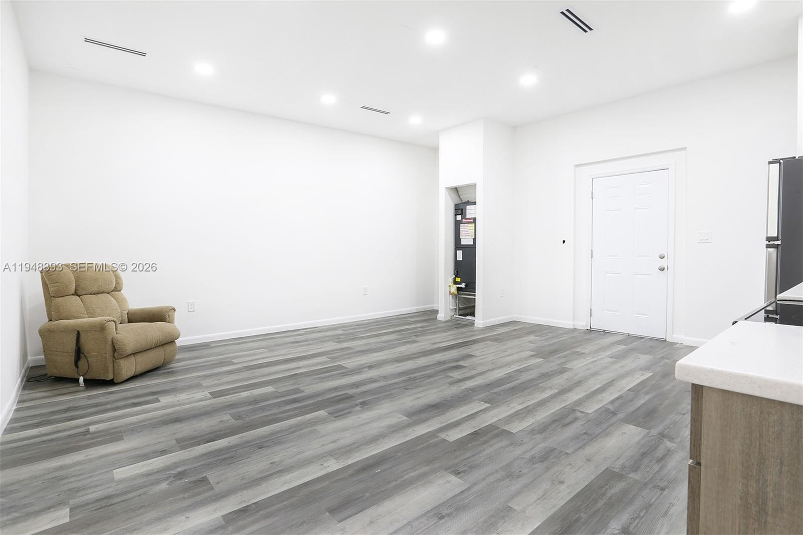 27440 Southwest 135th Ave Road Homestead, FL 33032 - Photo 70 of 75 a view of room with furniture and wooden floor