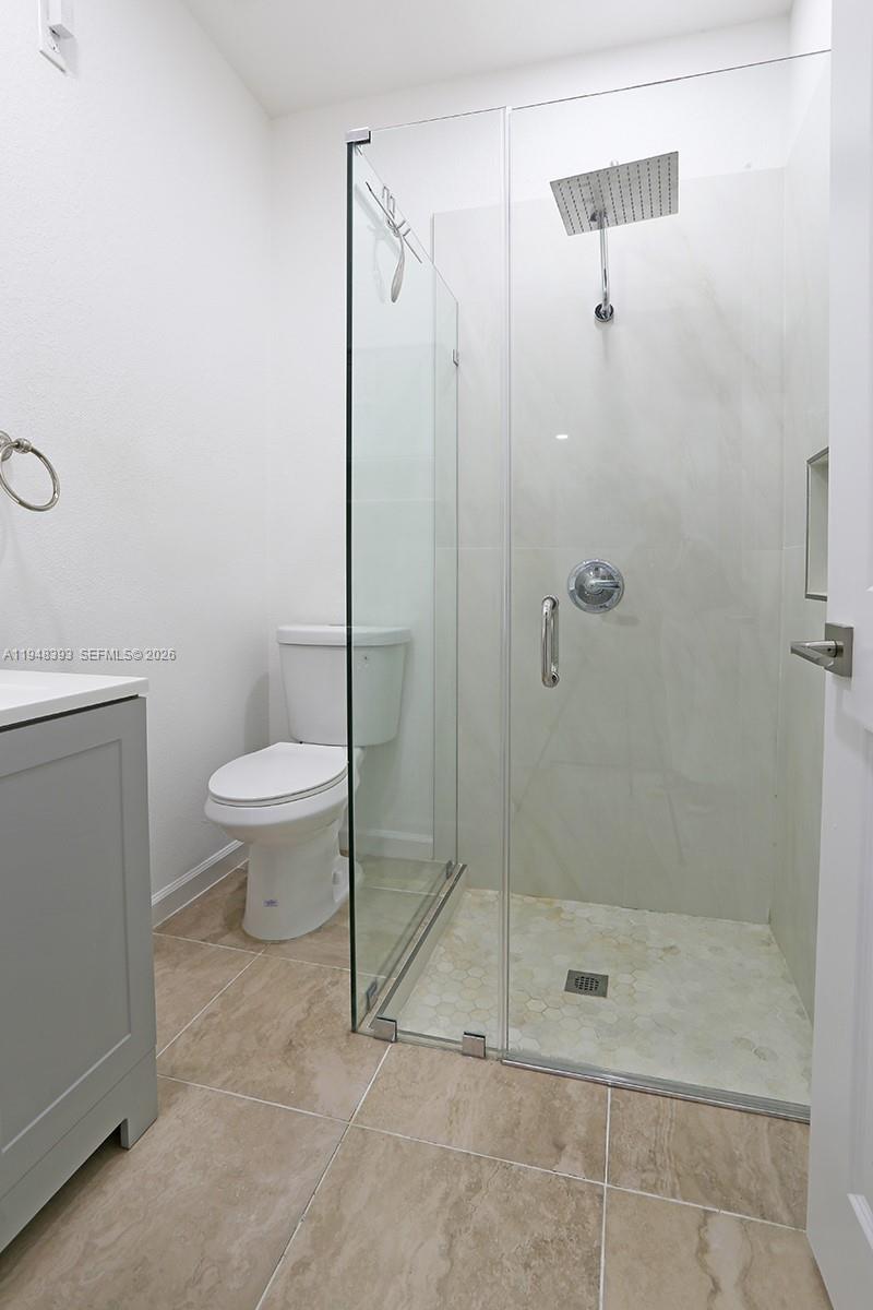 27440 Southwest 135th Ave Road Homestead, FL 33032 - Photo 72 of 75 a bathroom with a shower a toilet and sink