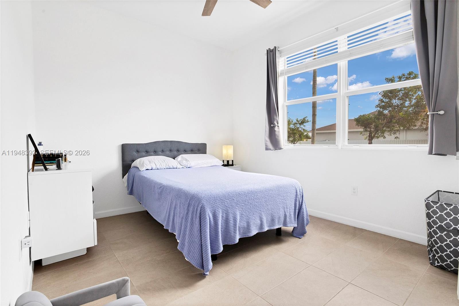 27440 Southwest 135th Ave Road Homestead, FL 33032 - Photo 10 of 75 a bedroom with a bed and a window