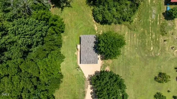 an aerial view of residential house with outdoor space