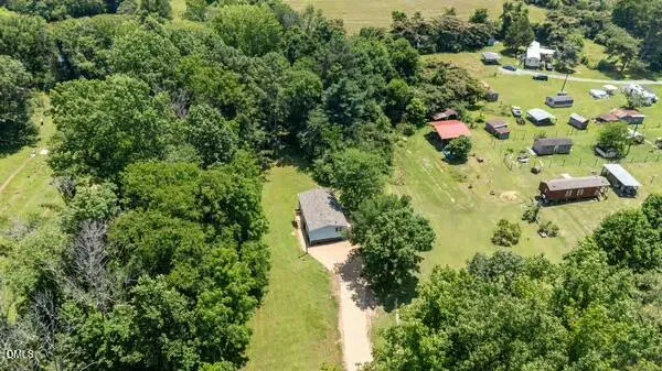 a view of a lake with a yard