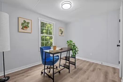 a kitchen with granite countertop white cabinets and a sink