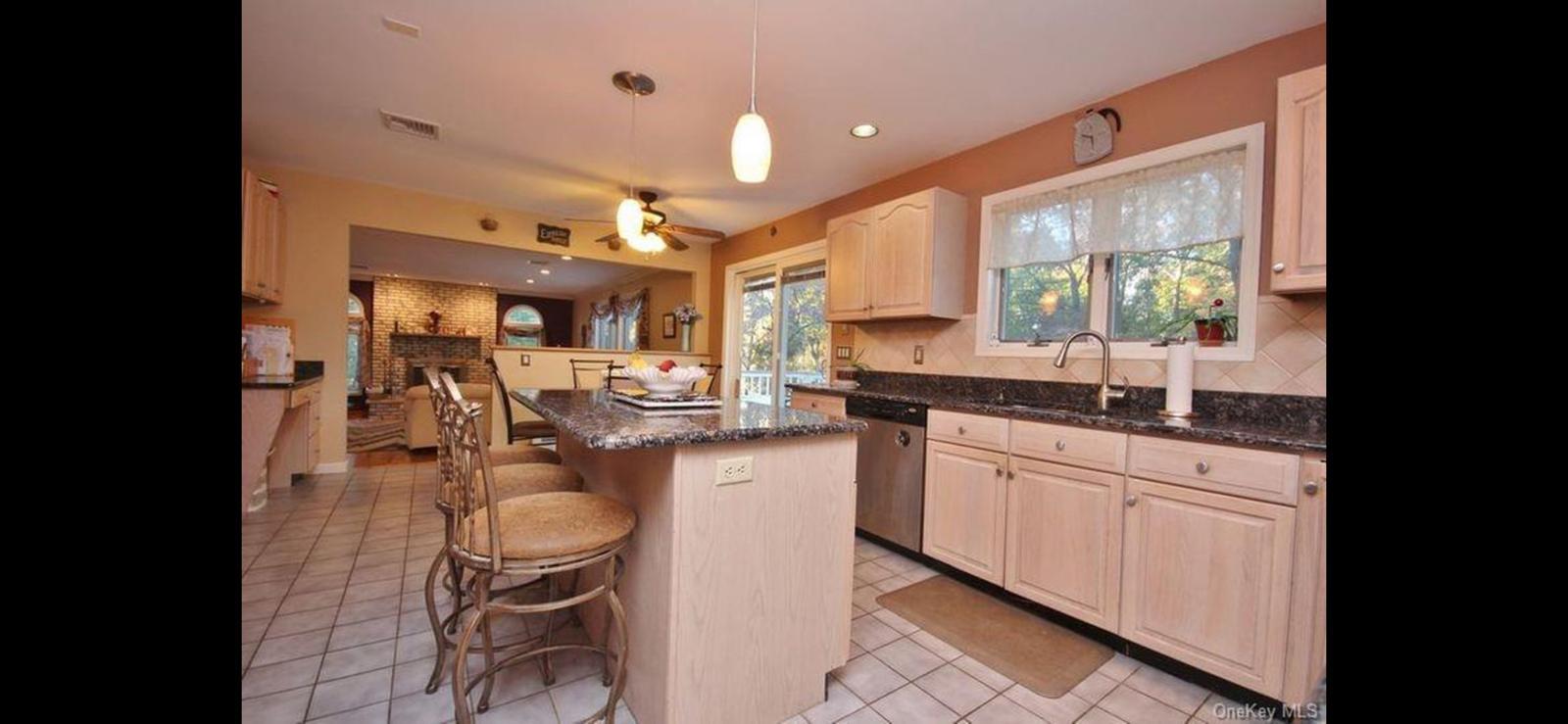 15 Ryder Court Stony Point, NY 10980 - Photo 11 of 31 a kitchen with sink refrigerator dining table and chairs