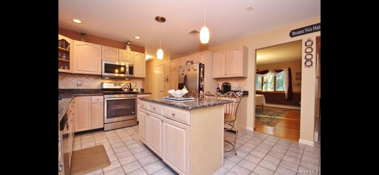 15 Ryder Court Stony Point, NY 10980 - Photo 14 of 31 a kitchen with stainless steel appliances kitchen island granite countertop a sink and cabinets